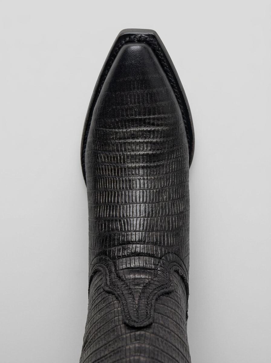 Lizard-embossed black leather western boot — toe detail